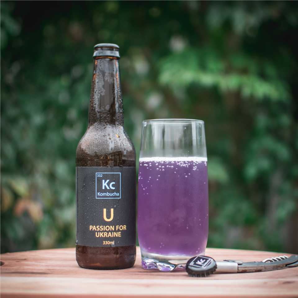 Passion for U Kc Kombucha bottle and glass